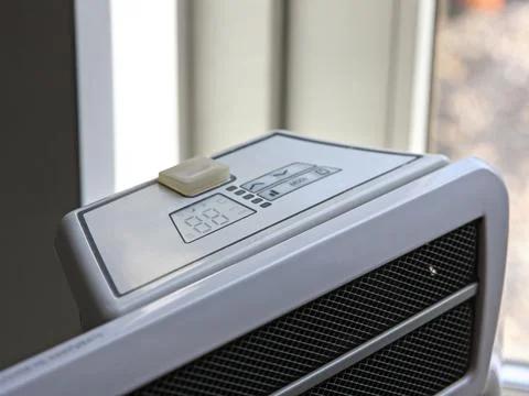 White modern electric convector for room heating Stock Photos