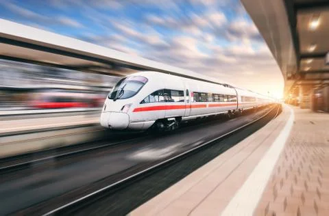 White modern high speed train in motion Stock Photos