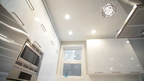 White modern kitchen in a house with a beautiful design Stock Footage 101855137