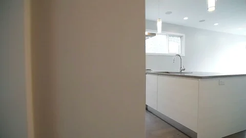 White modern kitchen in a house with a beautiful design Stock Footage 101857594