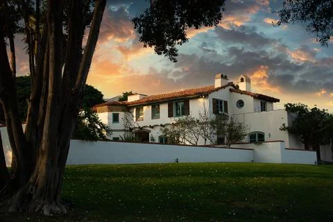 White modern structure features a crisp white facade in sunset Stock Photos