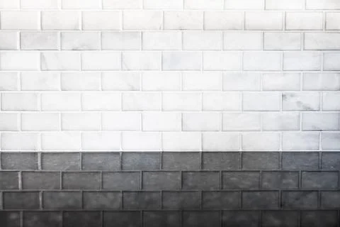 White modern subway tile pattern with reflection on black granite stone Stock Photos
