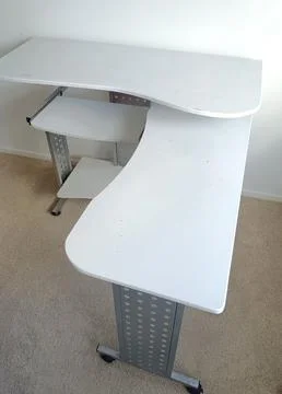 White modular computer desk with multiple shelves, metal supports, Stock Photos