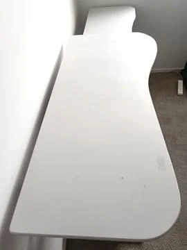 White modular computer desk with multiple shelves, metal supports, Stock Photos