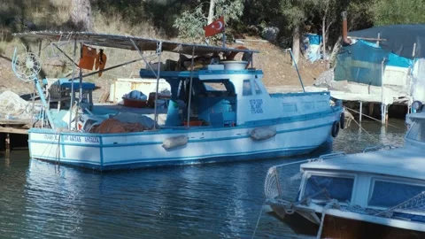 White moored boat on a river with reflection Stock Footage 167709365
