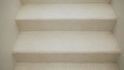 White mosaic tiled staircase with aged grout Stock Footage 342289121