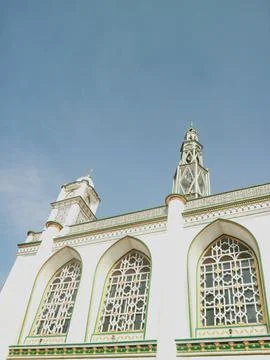 White mosque with blue sky background for islamic theme quotes or greeting Stock Photos