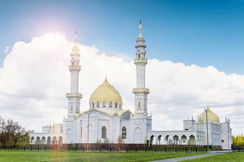 White Mosque on sky background with clouds in summer Stock Photos