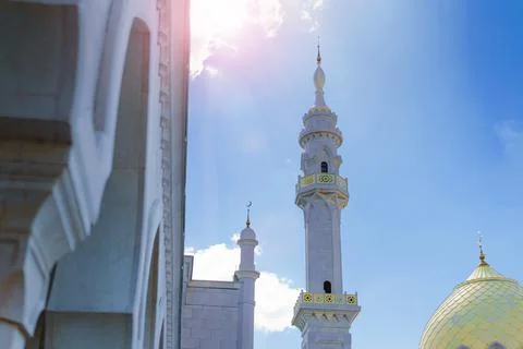 White Mosque on sky background with clouds in summer Stock Photos