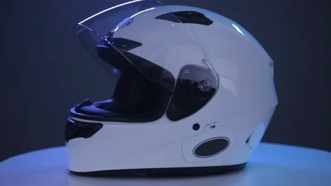 White motorcycle full-face helmet rotates on gray background. Video stock 107969854