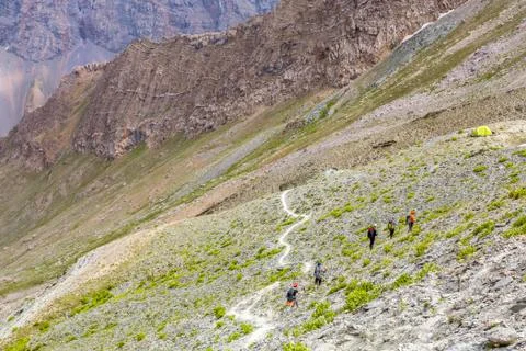 White mountain footpath and group of hikers Stock Photos