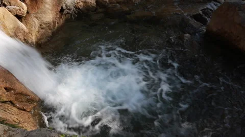 White mountain stream water falling down Stock Footage 62981148