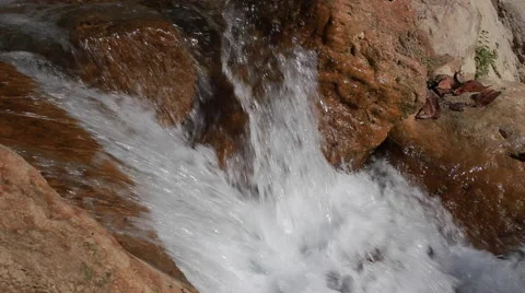 White mountain stream water falling down Stock Footage 62981729