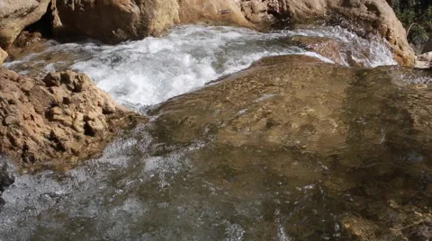White mountain stream water, flowing through the stones Stock Footage 62981699