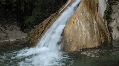 White mountain stream water, moving down through the stone Stock Footage 62981725