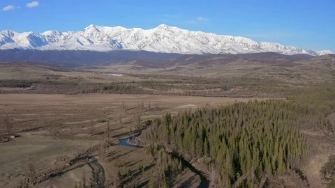 White mountain tops, blue sky, river, forests. Shooting with drone 4K. Stock Footage 115960897