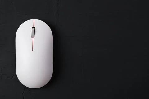 White mouse on a dark background. Stock Photos