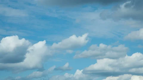 White moving clouds in the blue sky Stock Footage 145518105