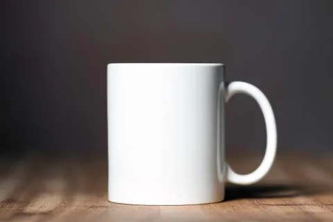 White mug on the desktop Stock Photos