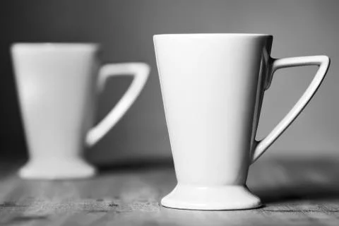 White mug on the desktop Stock Photos