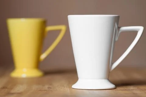 White mug on the desktop Stock Photos