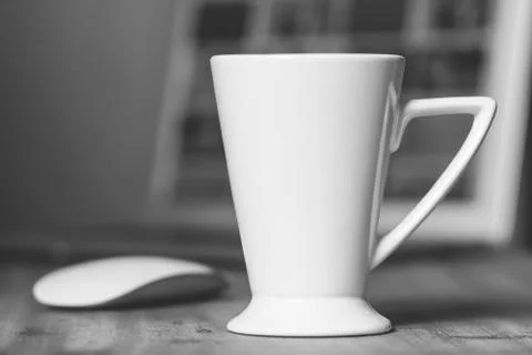 White mug on the desktop Stock Photos