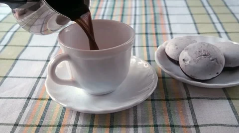 In a White Mug Filled With Coffee Vídeos de archivo 63384294