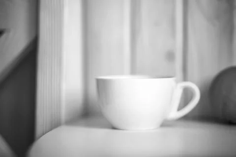 White mug on kitchen table Stock Photos