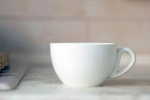 White mug on kitchen work surface Stock Photos