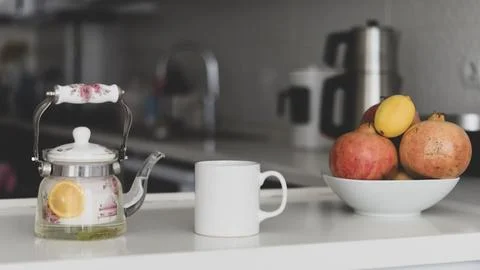 White Mug mockup. white empty mug mockup in a modern kitchen with a hot tea Stock Photos