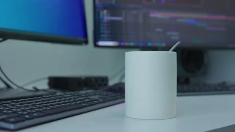 A white mug stands on the table and steam rises from it Stock Footage 271064310