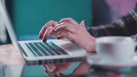 White mug with tea on the table near laptop Stock-Footage 69739859