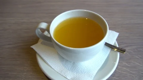 White mugs with tea slow Stock-Footage 85828577