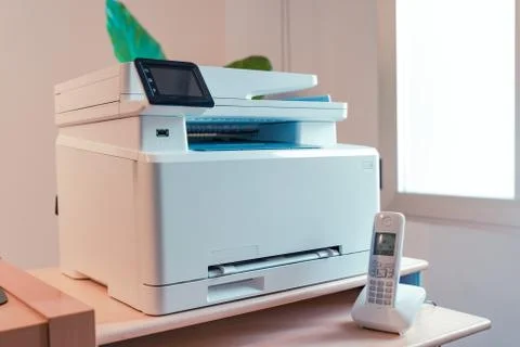White Multi function color laser printer and wireless phone terminal. Foto stock