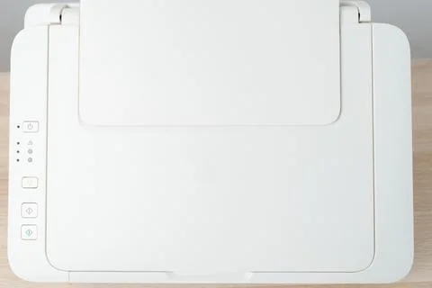 White Multifunction Printer And Scanner On Wooden Desk Top View Minimal Off.. Stock Photos