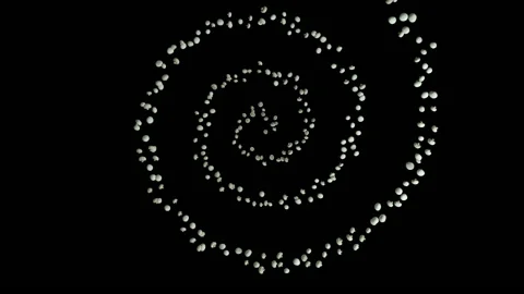 White Mushroom flying in helix shape, upper view, seamless loop, against black Stock Footage 135681792