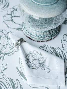 White napkin with a silver ring on the table, thuja twigs Stock Photos