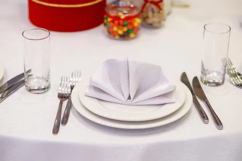 White napkin on the table Stock Photos
