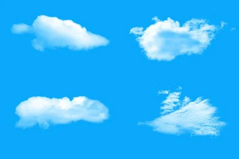 White natural clouds on a blue background. Stock Photos