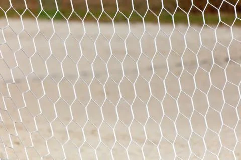 A white net with a pattern of squares and triangles 스톡 사진