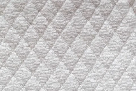 White new fabric in diamond pattern, background, macro. Stylish Stock Photos