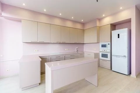 White new kitchen set. Kitchen furniture is new with all kitchen appliances.  Stock Photos