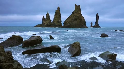White nights view of Reynisdrangar cliffs in the Atlantic ocean. South Icelan Stock Footage 67095849