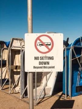 White no setting down beyond this point bus sign marina boats parked holiday  Stock Photos