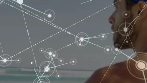 White node fading above sea starting tech mesh nodes around goggled man viewing 스톡 동영상 311084979