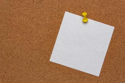 White note sheet pinned on cork board Stock Photos