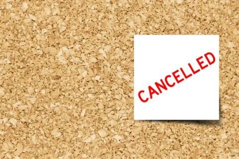White note with word cancelled on cork board background with copy space (Vect Illustrazione stock