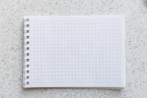 White notebook in a cage on a spiral close-up Stock Photos