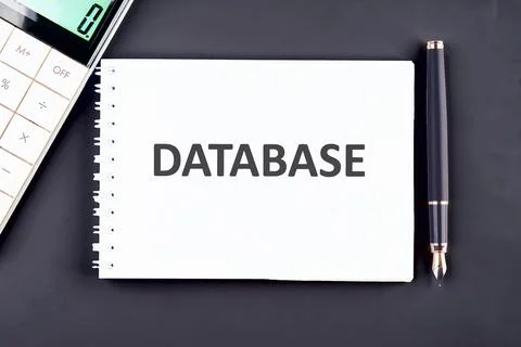 A white notebook features the word database prominently displayed on its page 스톡 사진