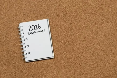 A white notebook at the left side of the screen with 2026 year resolutions in Foto stock